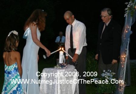 Jamie and John lighting their unity candle